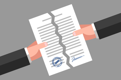 Two hands are tearing up a signed paper. Cancellation of contract, document or agreement. Business concept